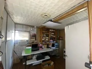 a room with wooden floor and window