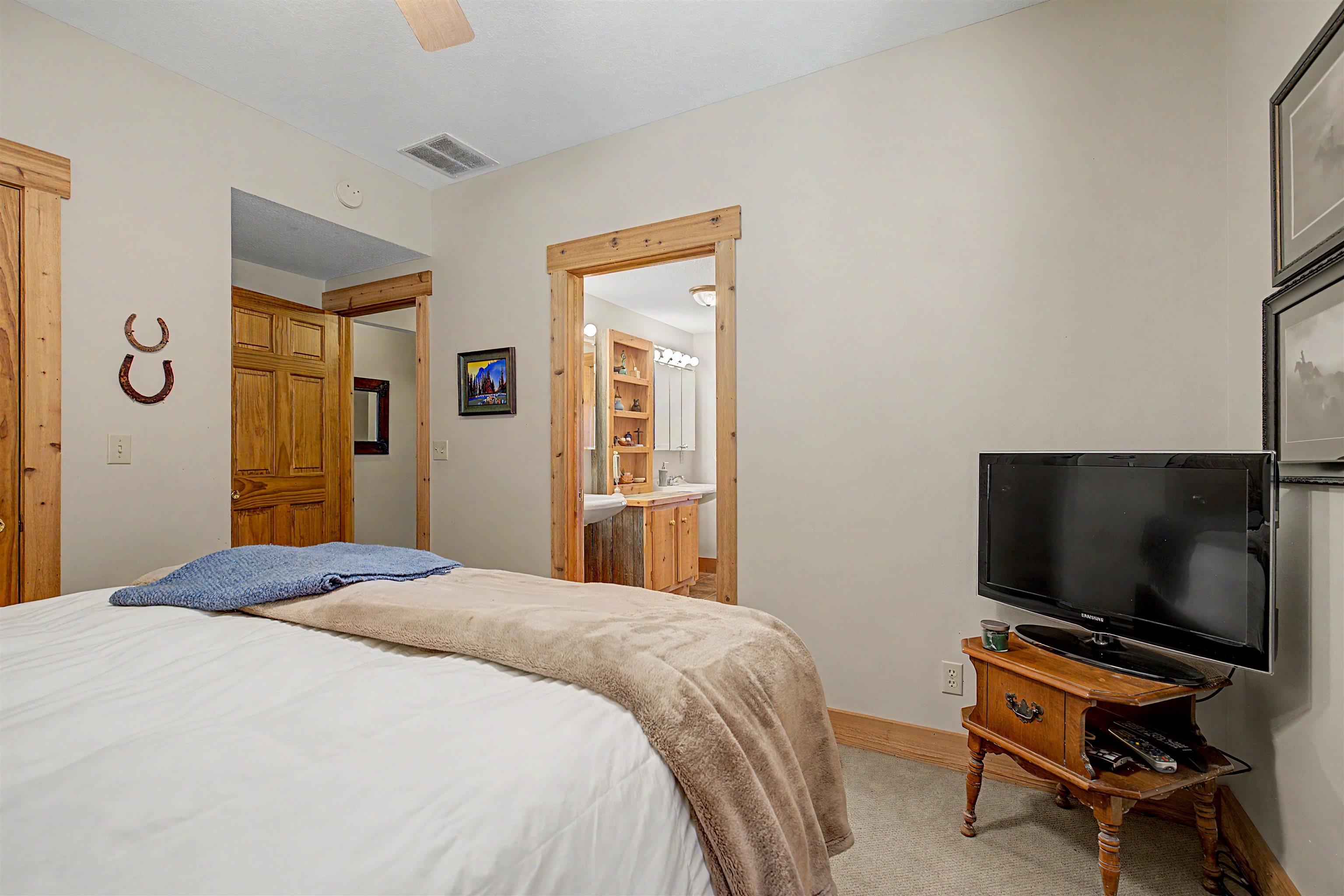 2287 West Hanover Road Hanover, IL 61041 - Photo 29 of 65 a bedroom with a bed and a flat screen tv