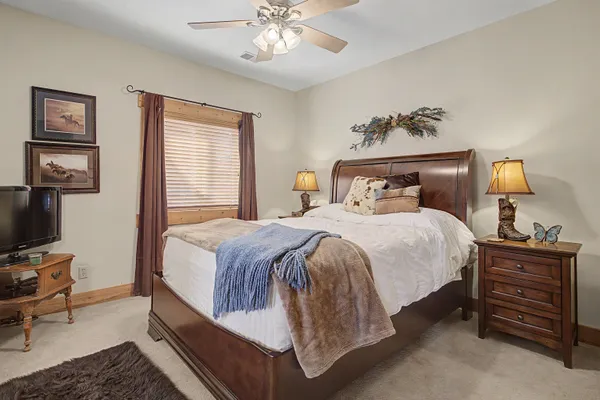 a bedroom with a bed and a dresser