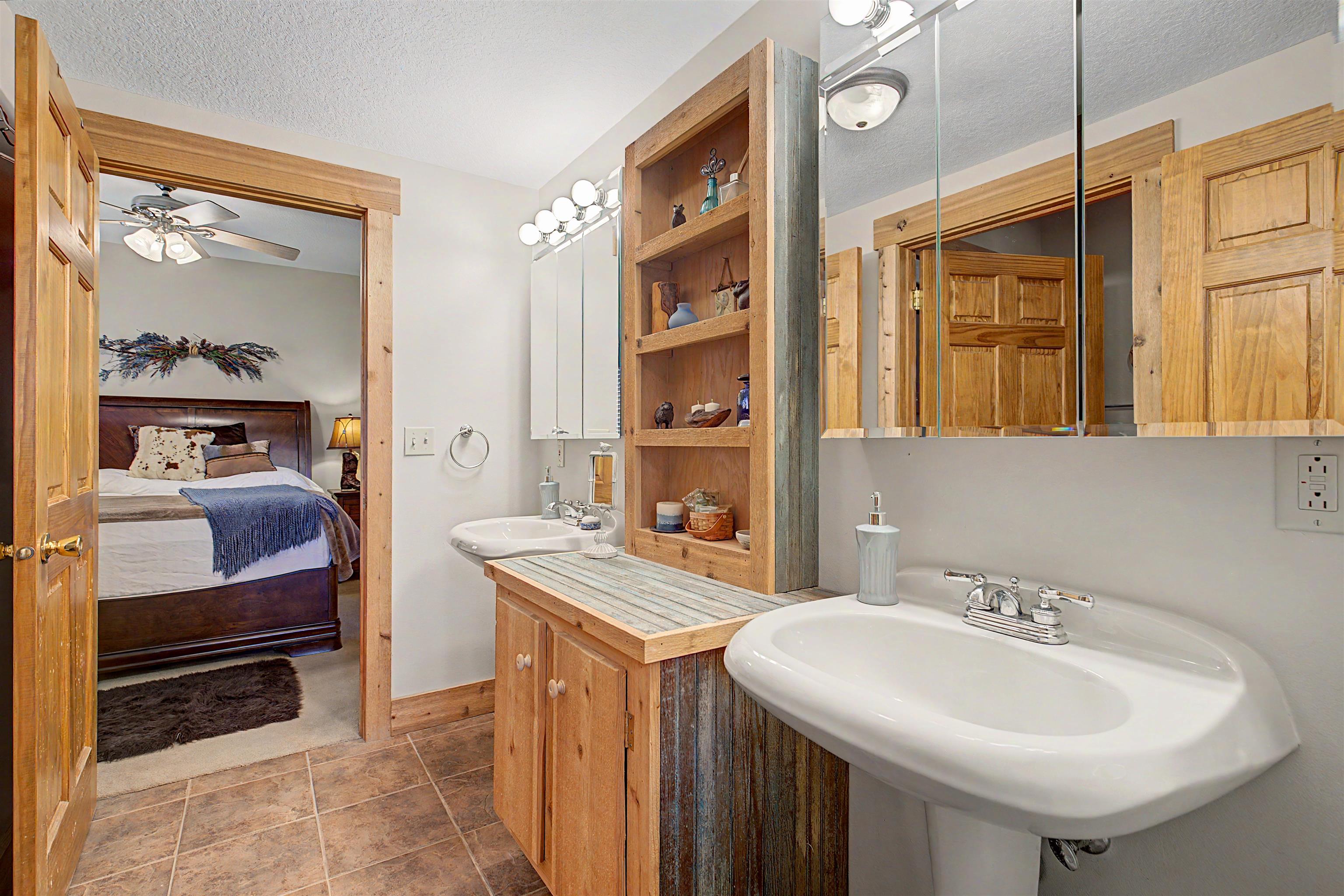 2287 West Hanover Road Hanover, IL 61041 - Photo 31 of 65 a bathroom with a sink a mirror and a toilet