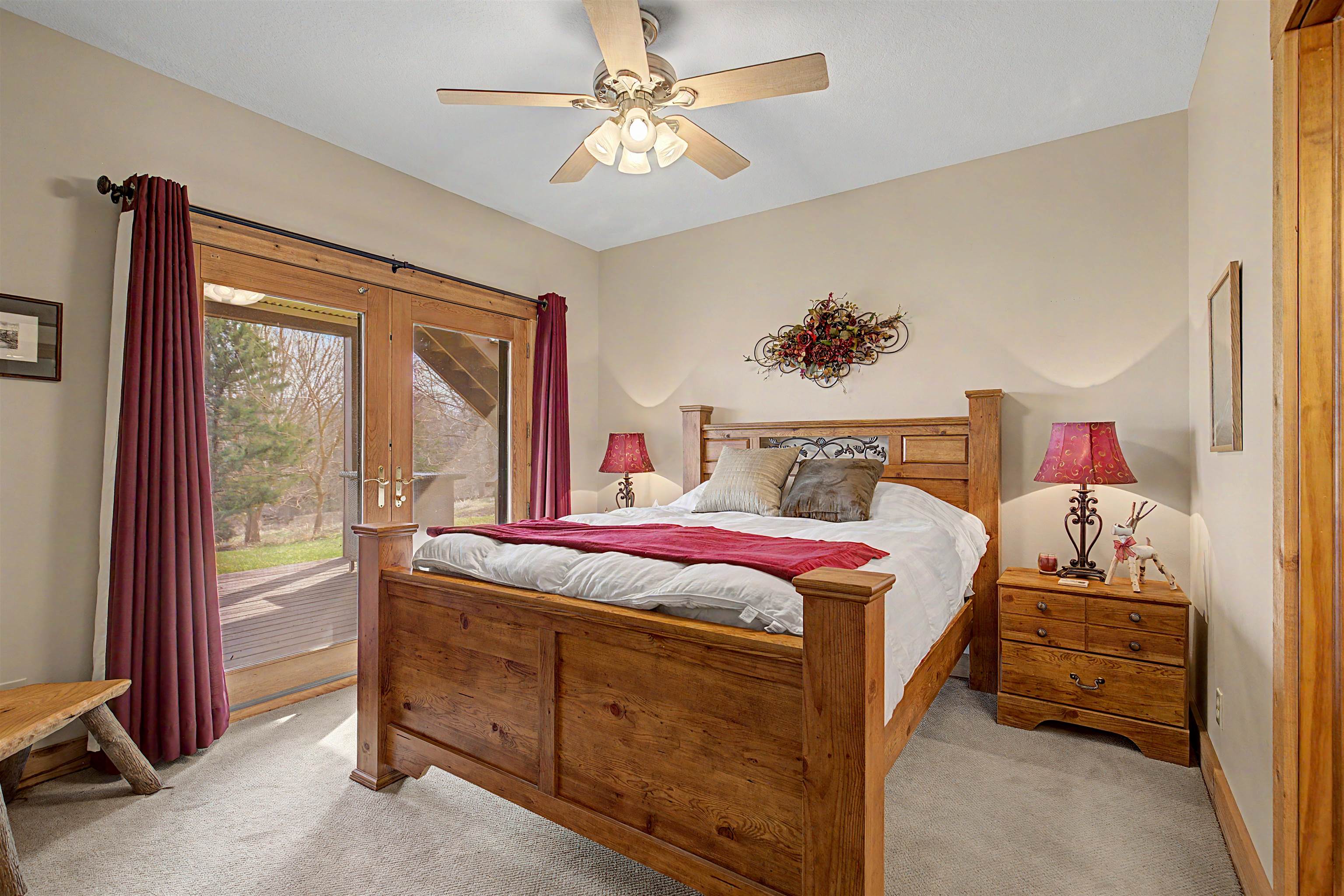 2287 West Hanover Road Hanover, IL 61041 - Photo 36 of 65 a bedroom with a bed and a chandelier