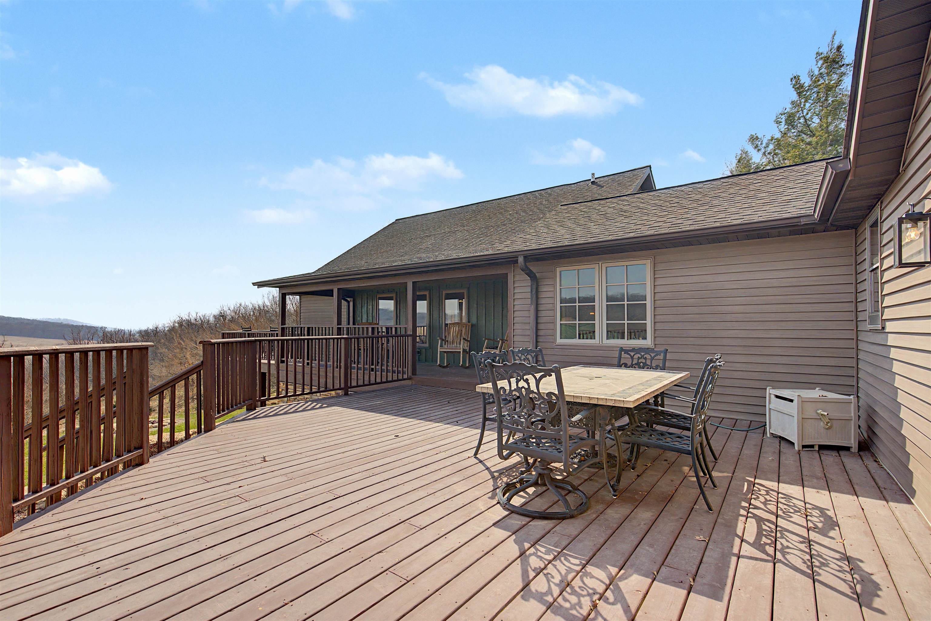 2287 West Hanover Road Hanover, IL 61041 - Photo 51 of 65 a balcony with wooden floor table and chairs