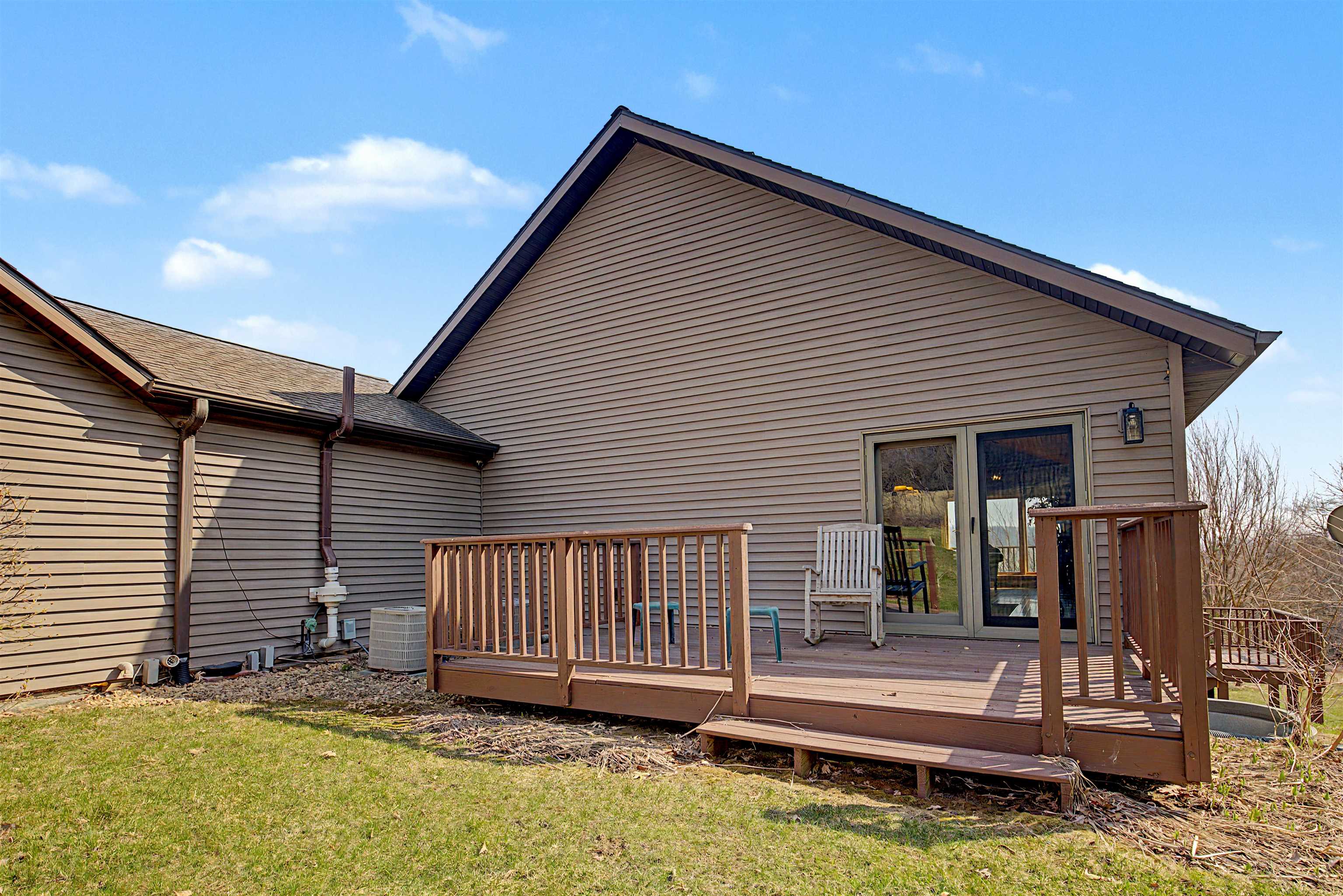 2287 West Hanover Road Hanover, IL 61041 - Photo 52 of 65 a view of a house with a backyard and wooden fence