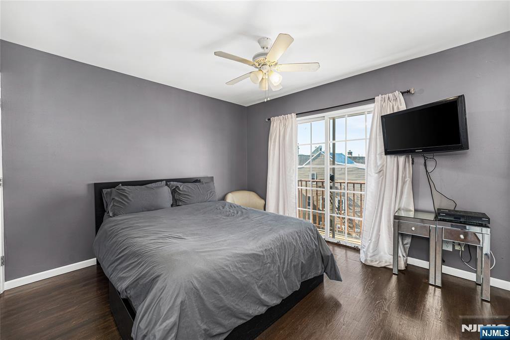 84 Union Street Newark, NJ 07105 - Photo 32 of 39 a bedroom with a bed and a flat screen tv