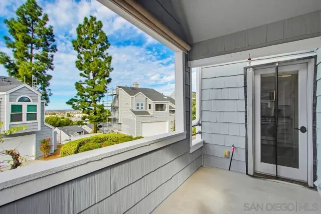 a front view of a house with a large window