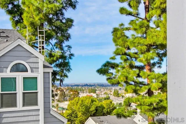 a bathroom with a tub and window
