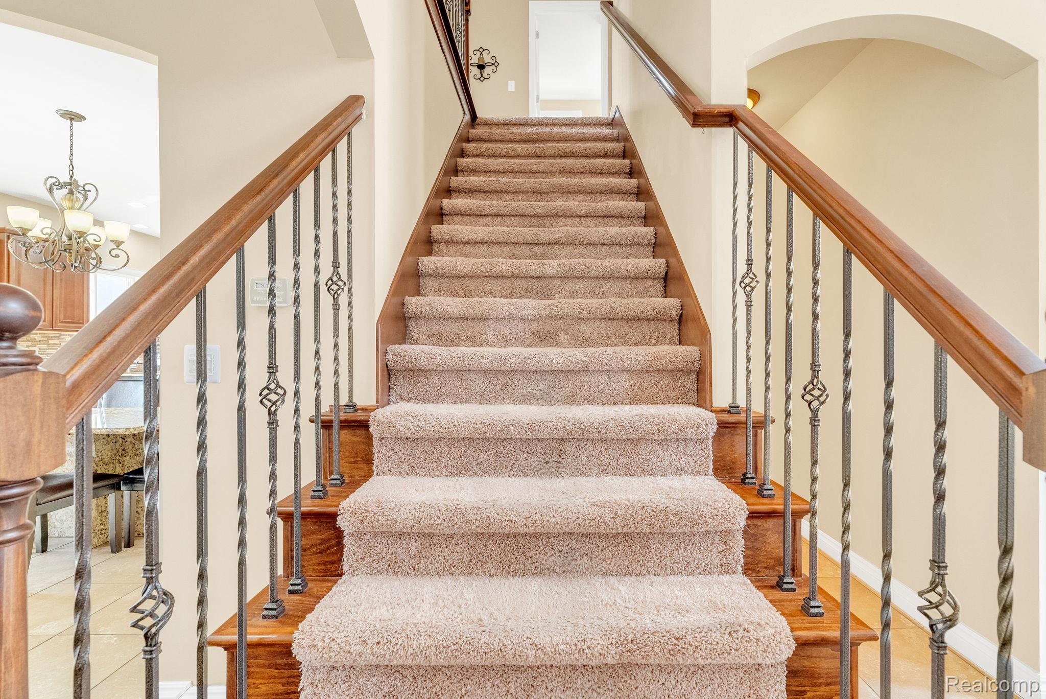 4122 Hawks Nest Road Utica, MI 48317 - Photo 36 of 74 Stairway featuring suspended lighting