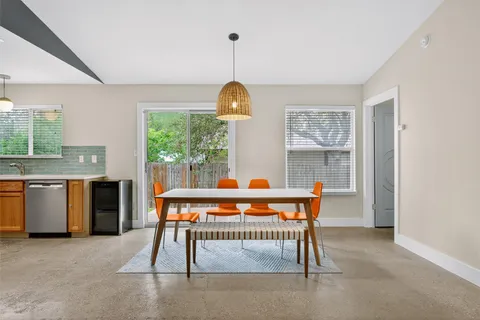 a room with furniture a window and a chandelier