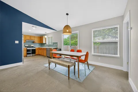 a living room with furniture a window and a table