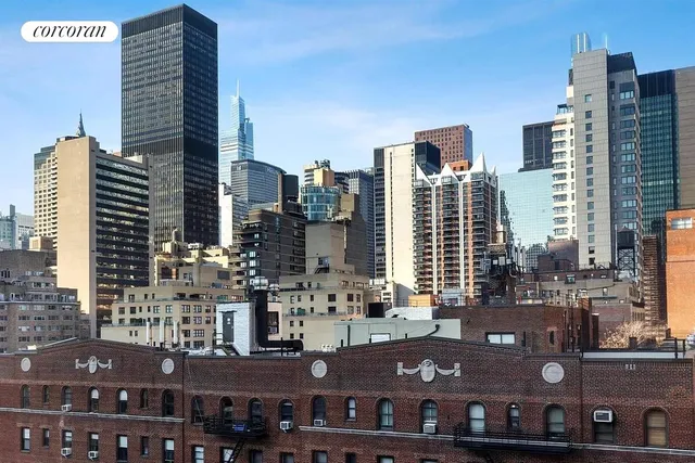 a view of a patio with couches table and chairs and potted plants