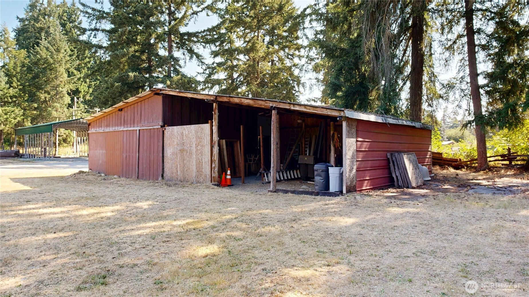 35812 Allen Road South Roy, WA 98580 - Photo 26 of 39 a view of a house with backyard and trees