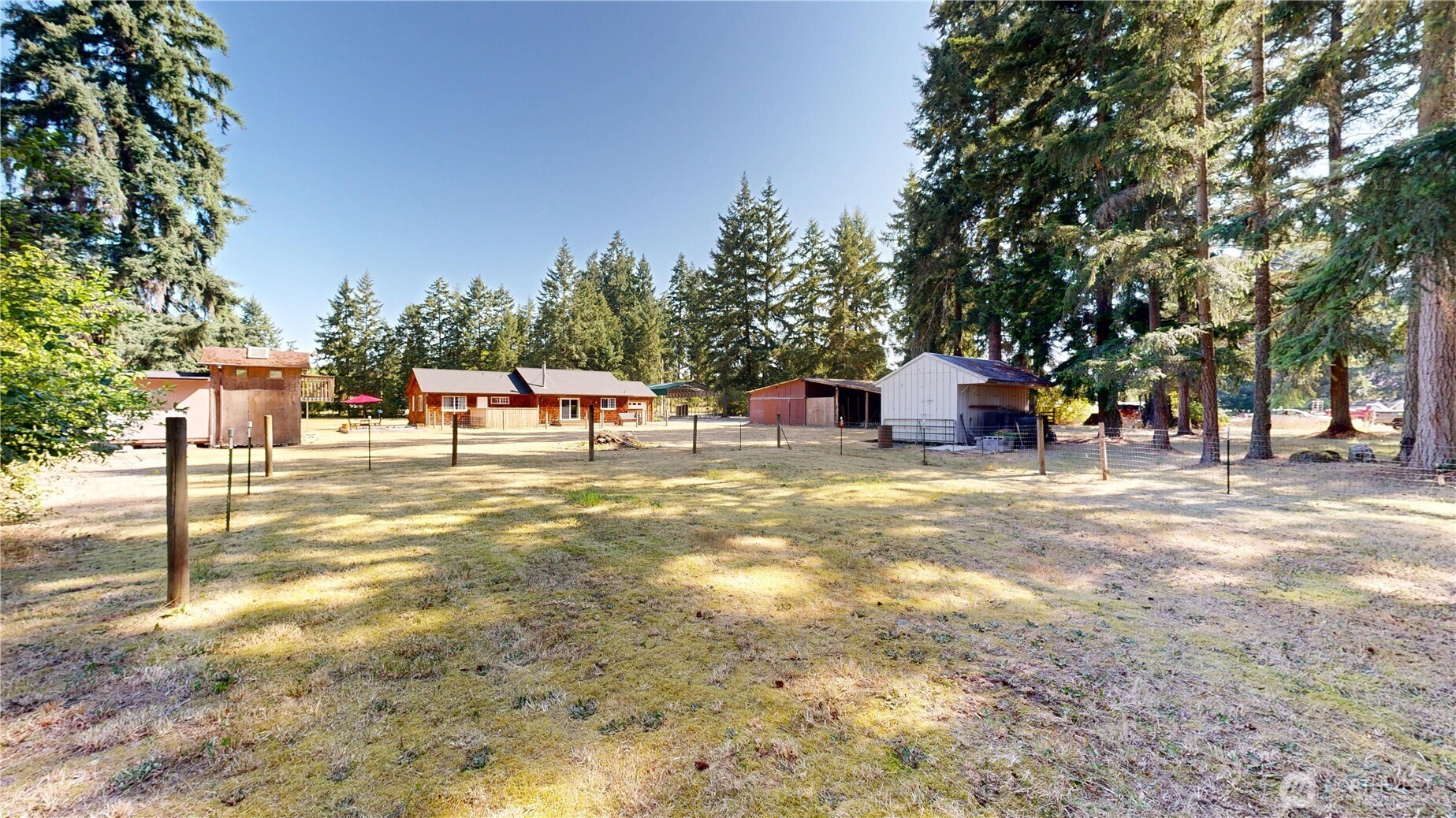 35812 Allen Road South Roy, WA 98580 - Photo 30 of 39 a view of a swimming pool with a lawn chairs