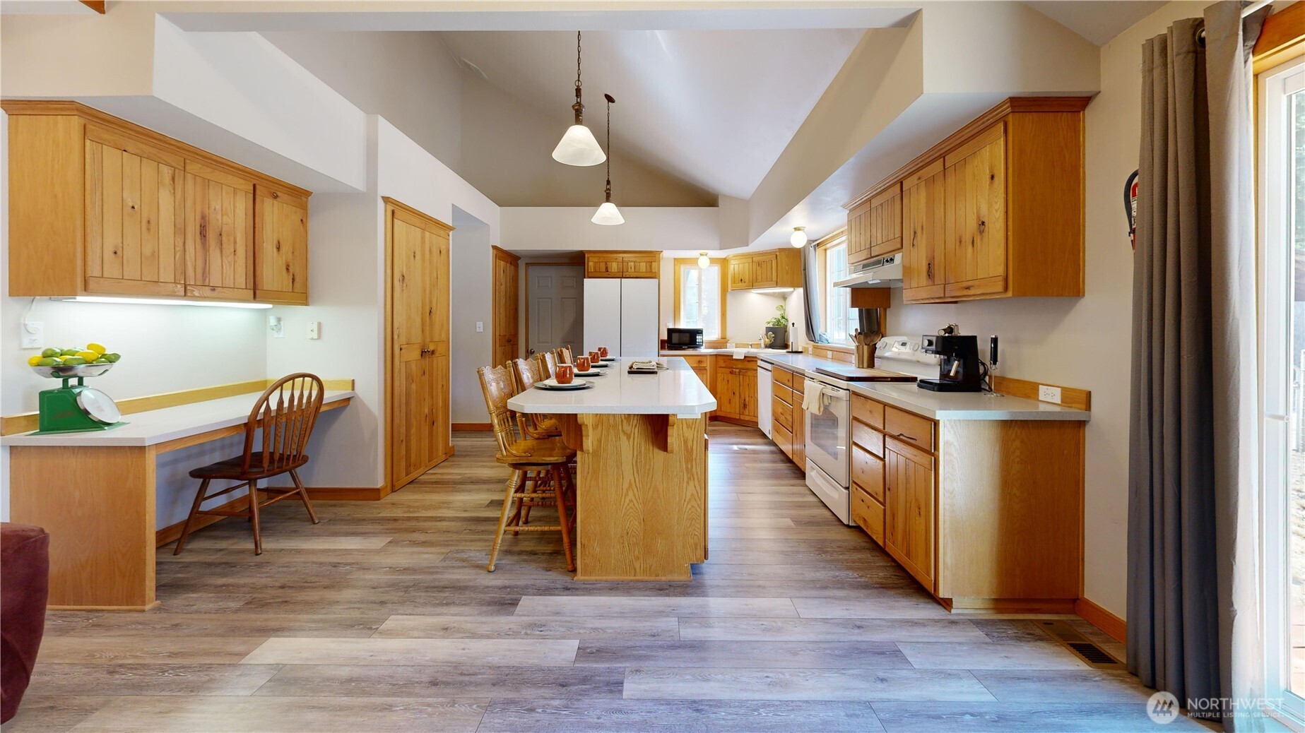 35812 Allen Road South Roy, WA 98580 - Photo 7 of 39 a view of a kitchen with kitchen island stainless steel appliances wooden floor and chair
