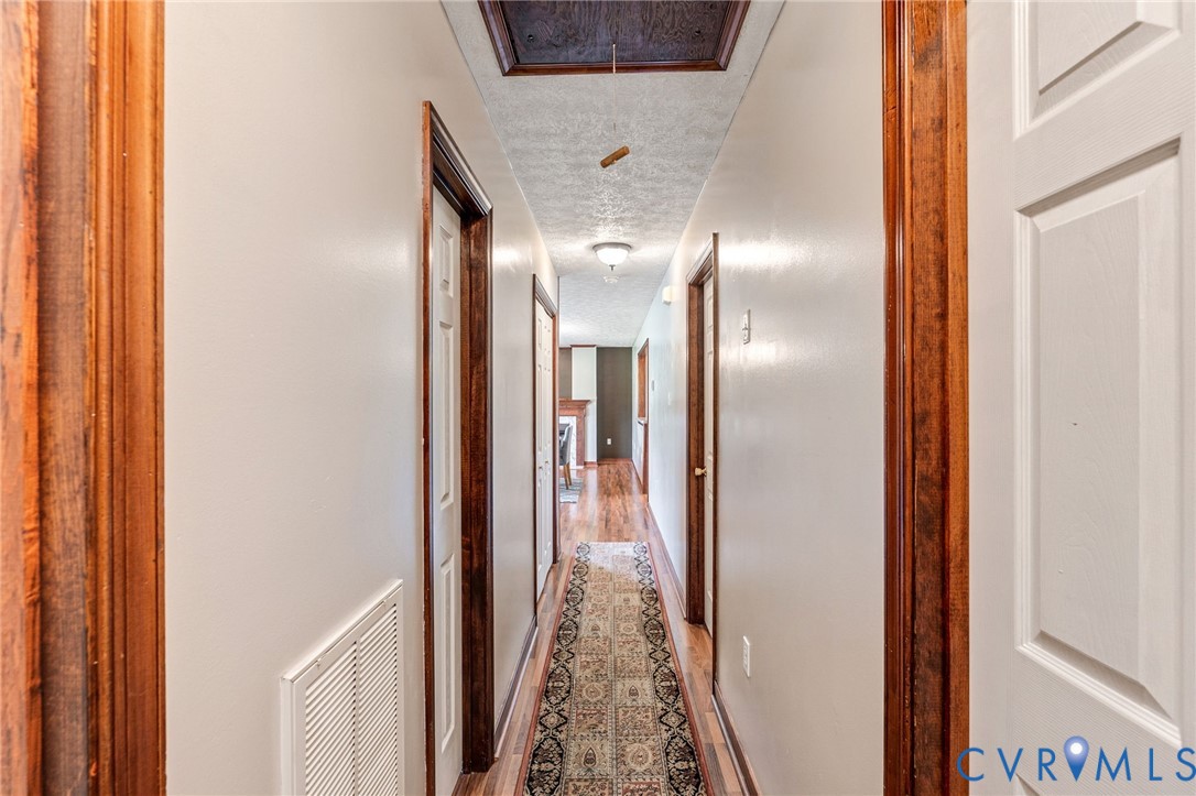 3411 Spring Run Road Mechanicsville, VA 23111 - Photo 18 of 41 a view of a hallway with wooden floor