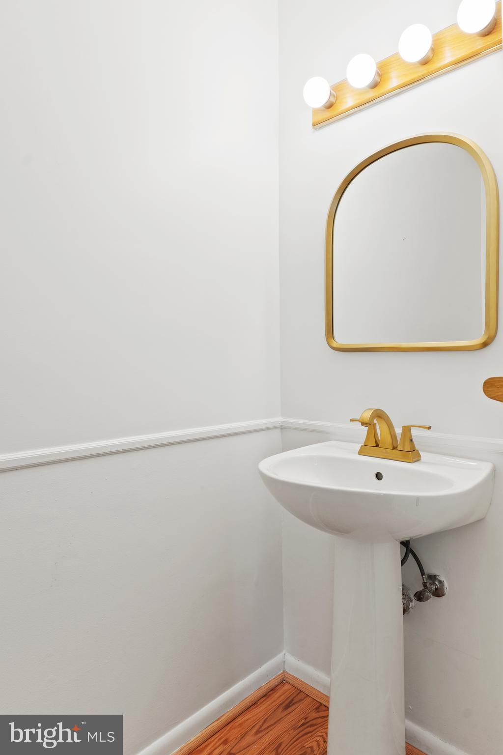 1204 Cedar Park Road, Unit 6 Annapolis, MD 21401 - Photo 17 of 51 a bathroom with a sink and mirror