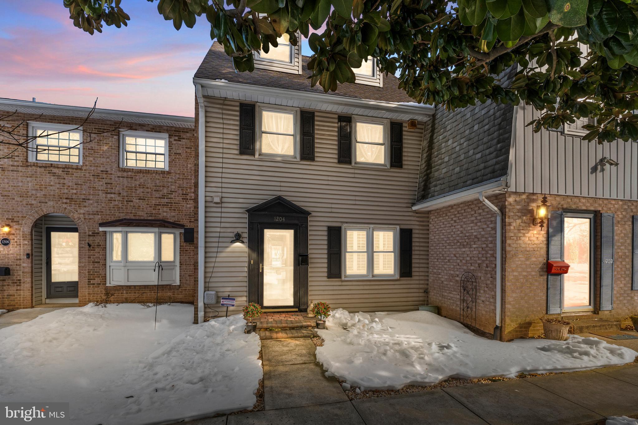 1204 Cedar Park Road, Unit 6 Annapolis, MD 21401 - Photo 2 of 51 a view of a house with a chairs and table in patio