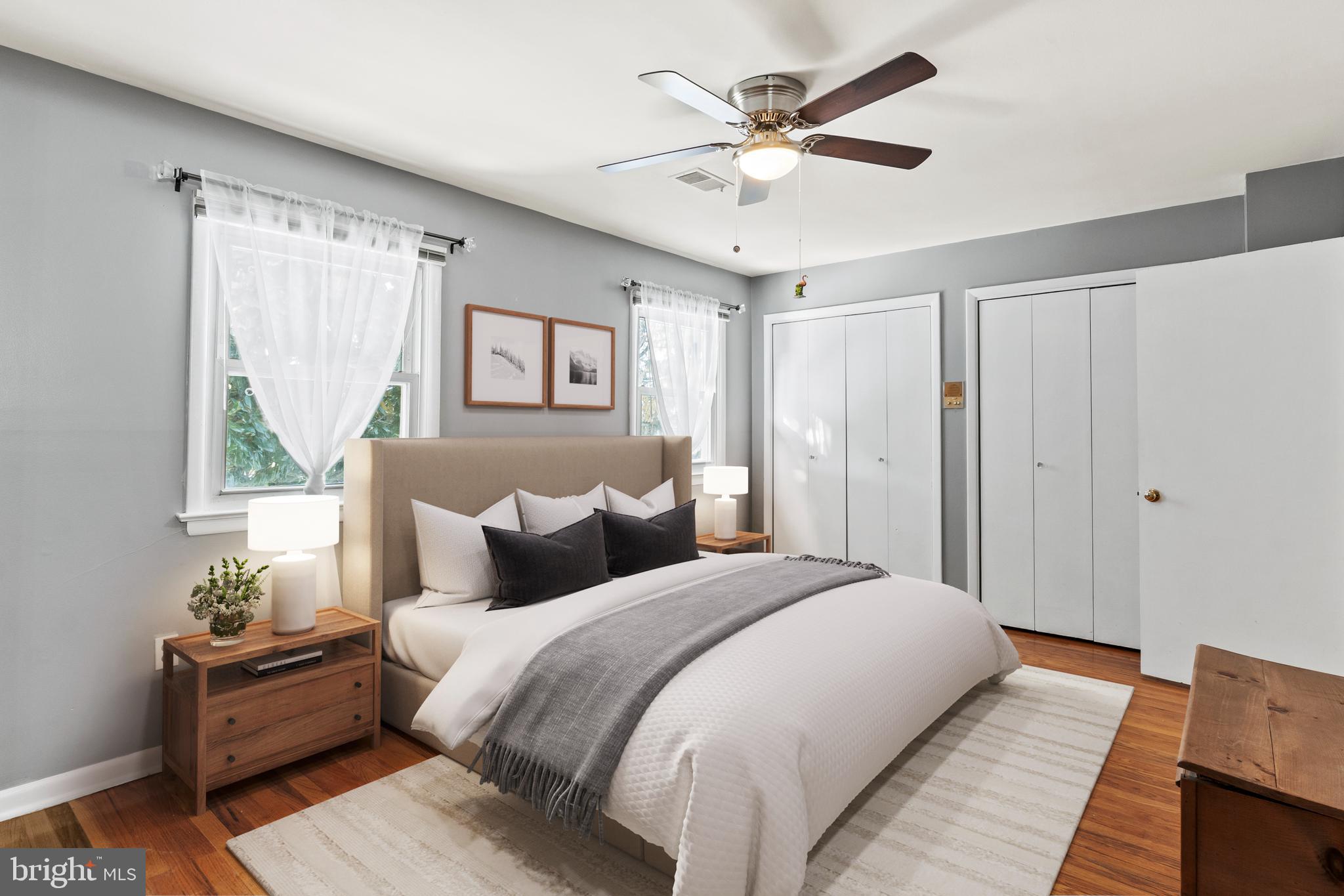 1204 Cedar Park Road, Unit 6 Annapolis, MD 21401 - Photo 21 of 51 a bedroom with a large bed and a chandelier