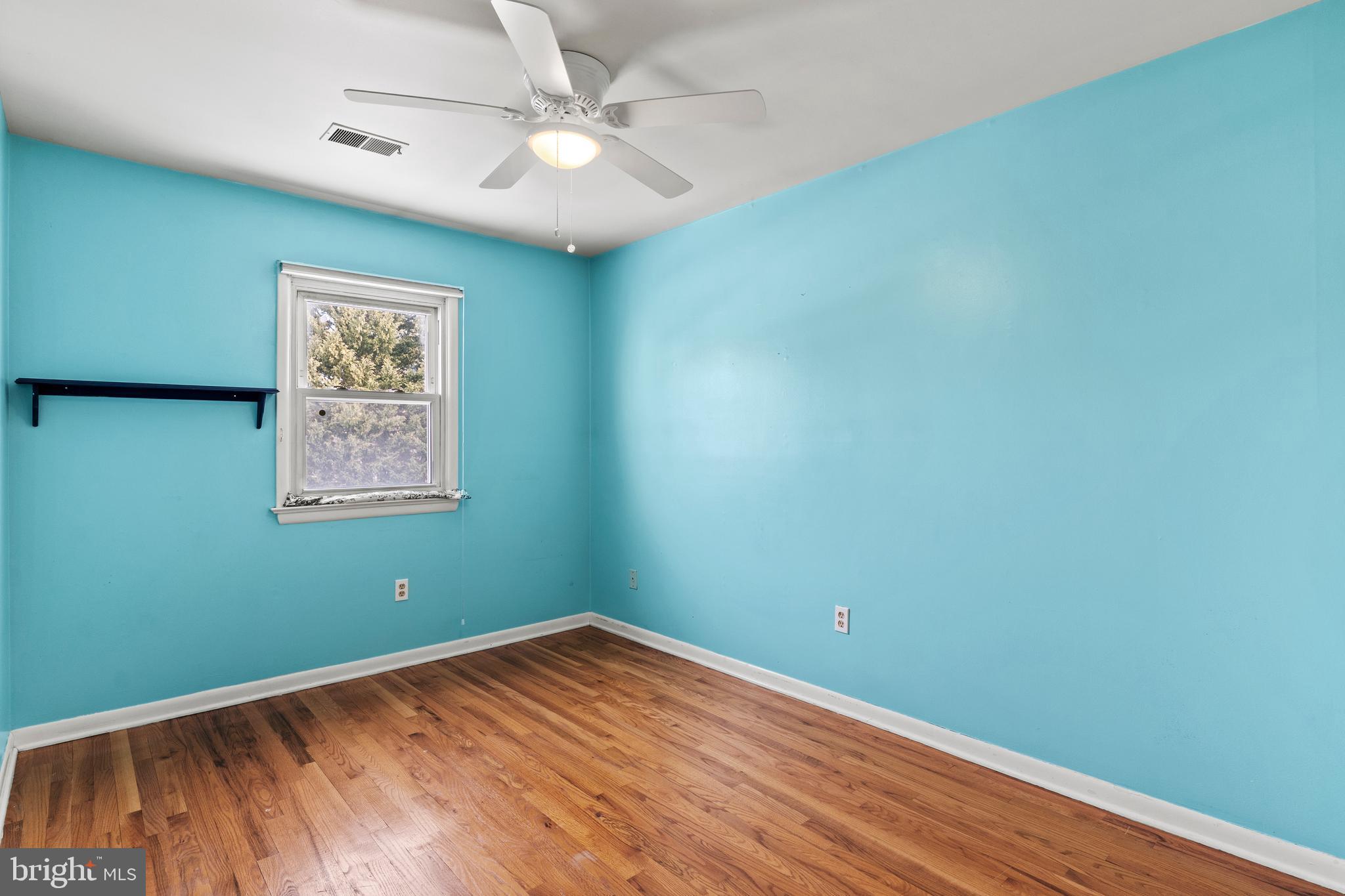 1204 Cedar Park Road, Unit 6 Annapolis, MD 21401 - Photo 29 of 51 an empty room with a window and ceiling fan