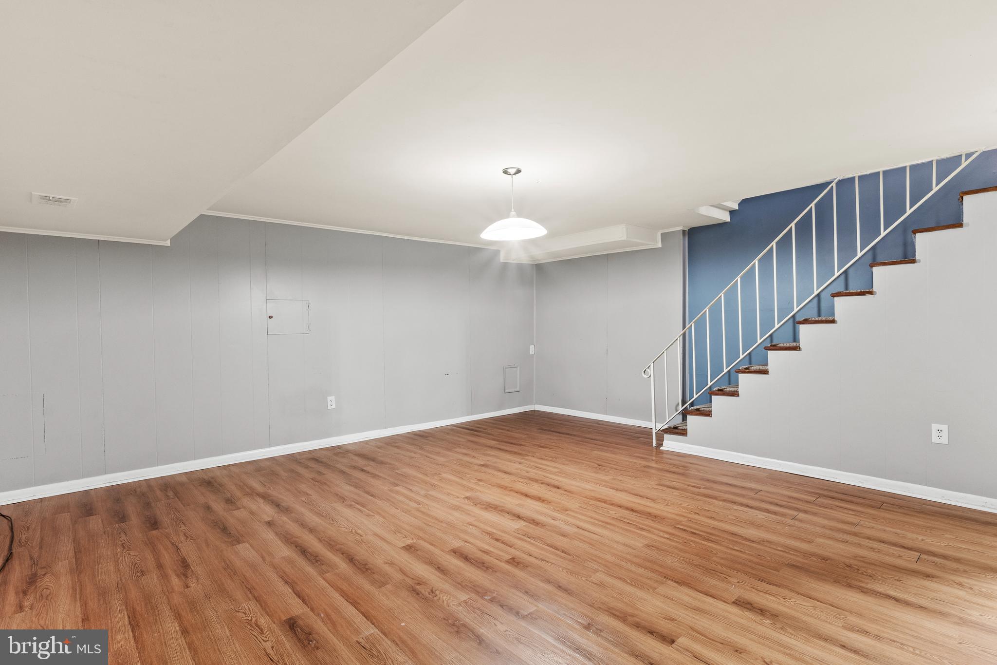 1204 Cedar Park Road, Unit 6 Annapolis, MD 21401 - Photo 35 of 51 a view of an empty room with wooden floor and stairs