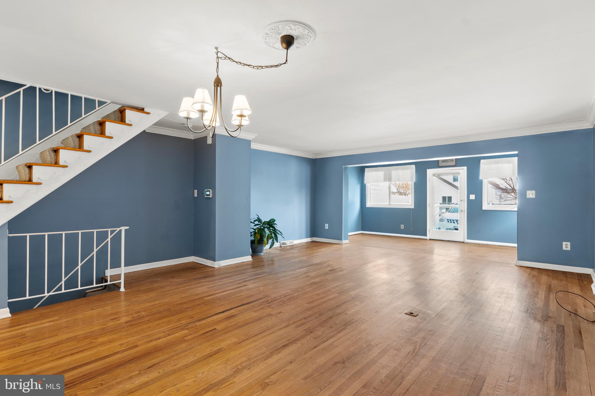 1204 Cedar Park Road, Unit 6 Annapolis, MD 21401 - Photo 4 of 51 a view of an empty room with wooden floor and fan