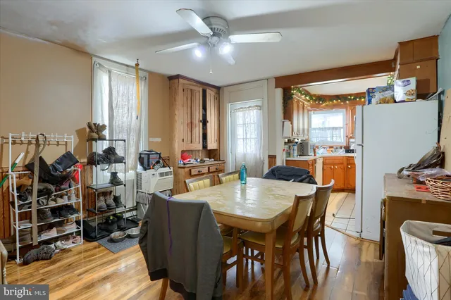 a view of a dining room with furniture and a chandelier