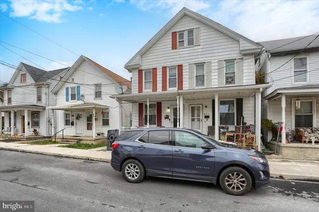 a car parked in front of a house