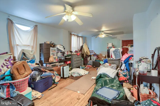 a living room filled with furniture and a chandelier