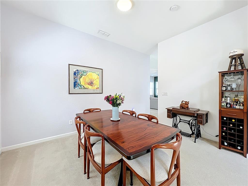 6573 Helmsley Circle Windermere, FL 34786 - Photo 14 of 54 a view of a dining room with furniture