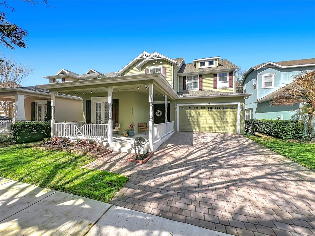 6573 Helmsley Circle Windermere, FL 34786 - Photo 2 of 54 a front view of a house with a garden and yard