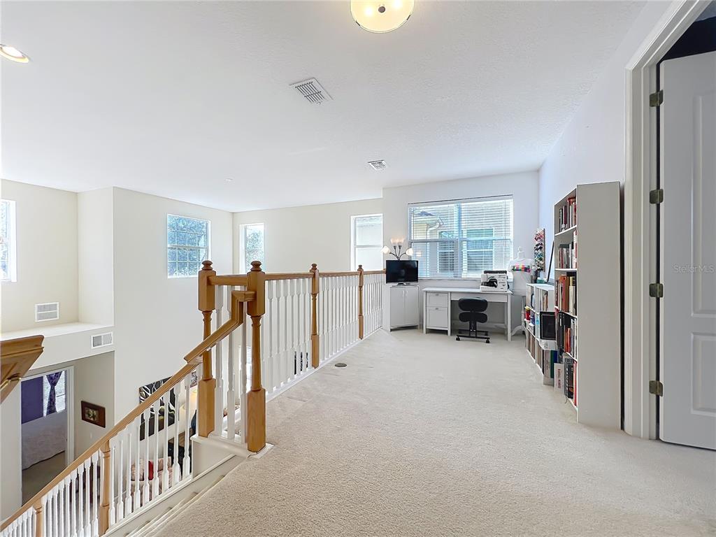 6573 Helmsley Circle Windermere, FL 34786 - Photo 30 of 54 a view of a livingroom with furniture and white walls