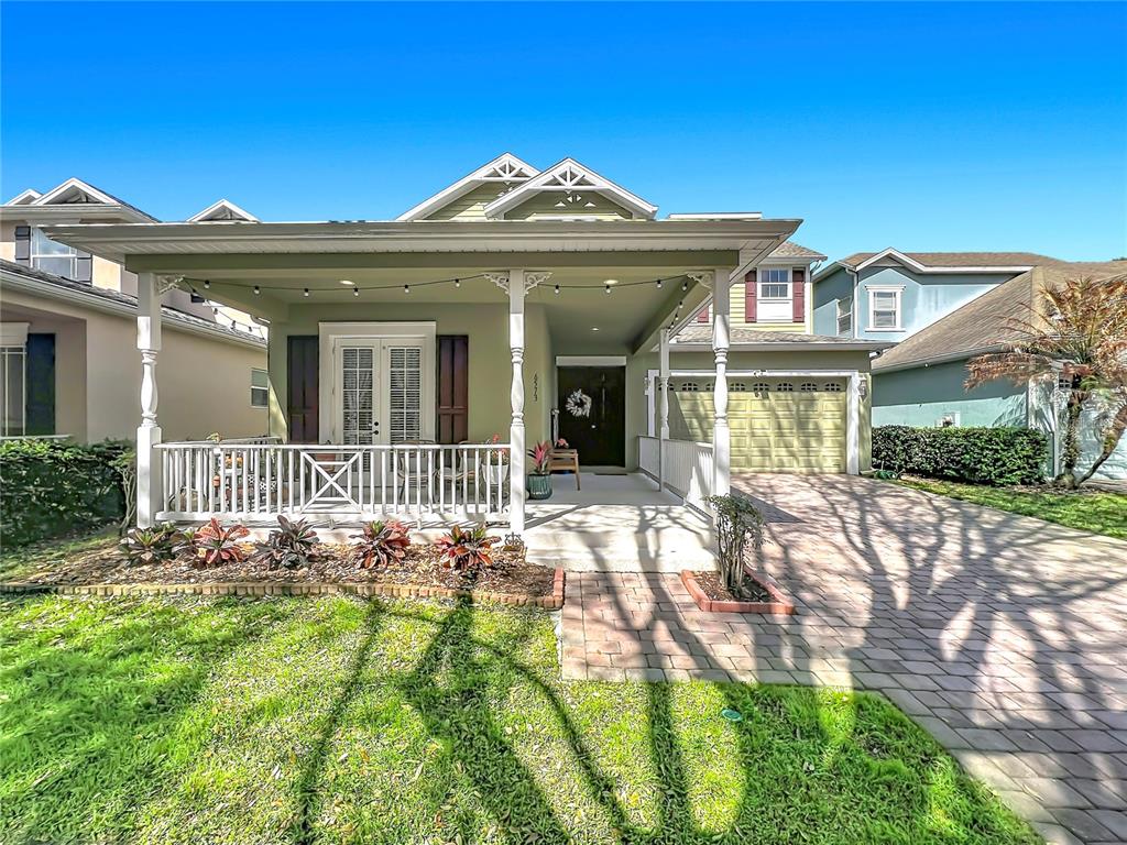 6573 Helmsley Circle Windermere, FL 34786 - Photo 3 of 54 front view of a house with a yard