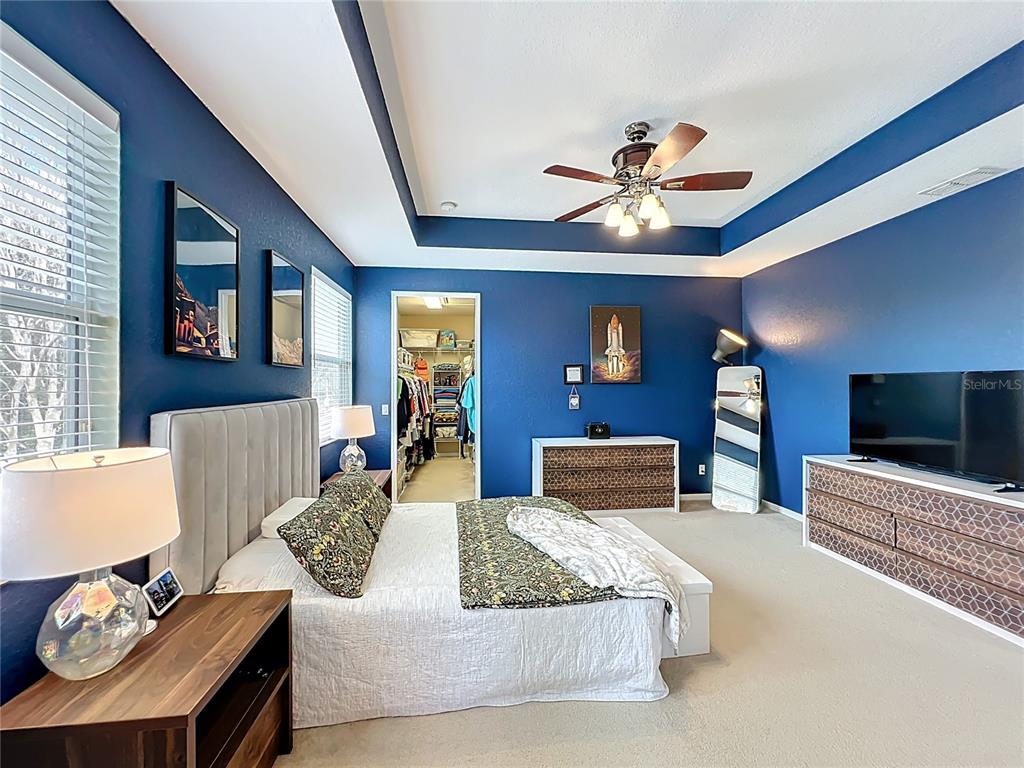 6573 Helmsley Circle Windermere, FL 34786 - Photo 38 of 54 a living room with furniture and a flat screen tv