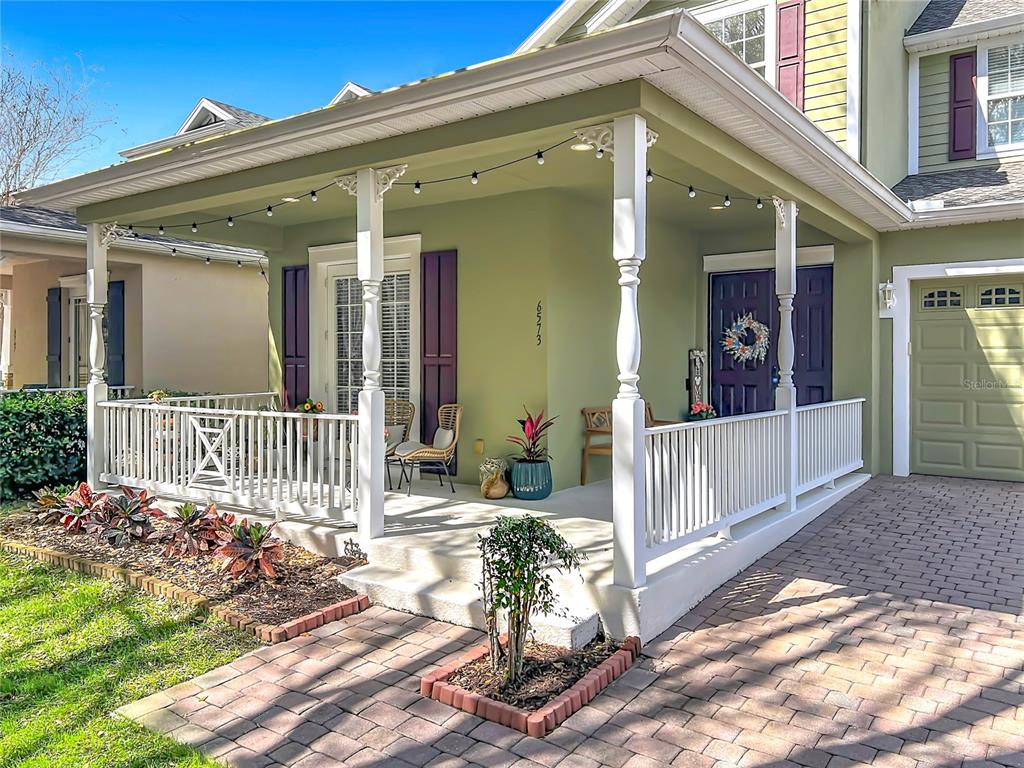 6573 Helmsley Circle Windermere, FL 34786 - Photo 4 of 54 a view of a house with a small yard and wooden floor and fence
