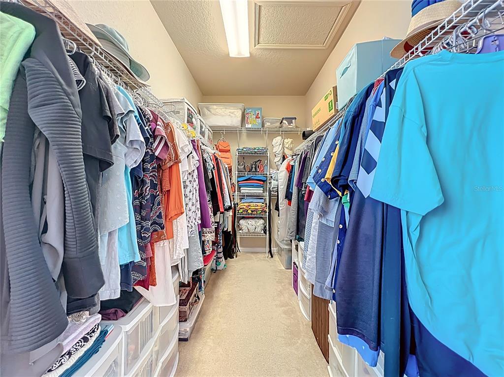 6573 Helmsley Circle Windermere, FL 34786 - Photo 42 of 54 a view of walk in closet with clothes
