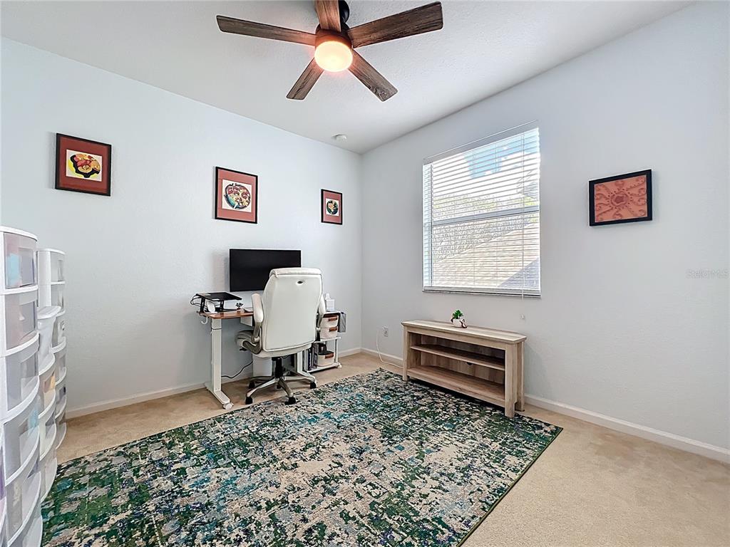 6573 Helmsley Circle Windermere, FL 34786 - Photo 43 of 54 a living room with a couch and a window