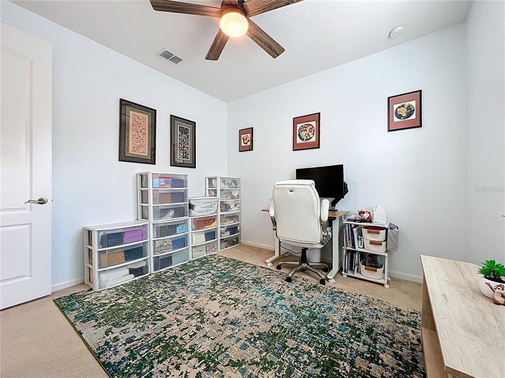 6573 Helmsley Circle Windermere, FL 34786 - Photo 44 of 54 a living room with a couch and a flat screen tv