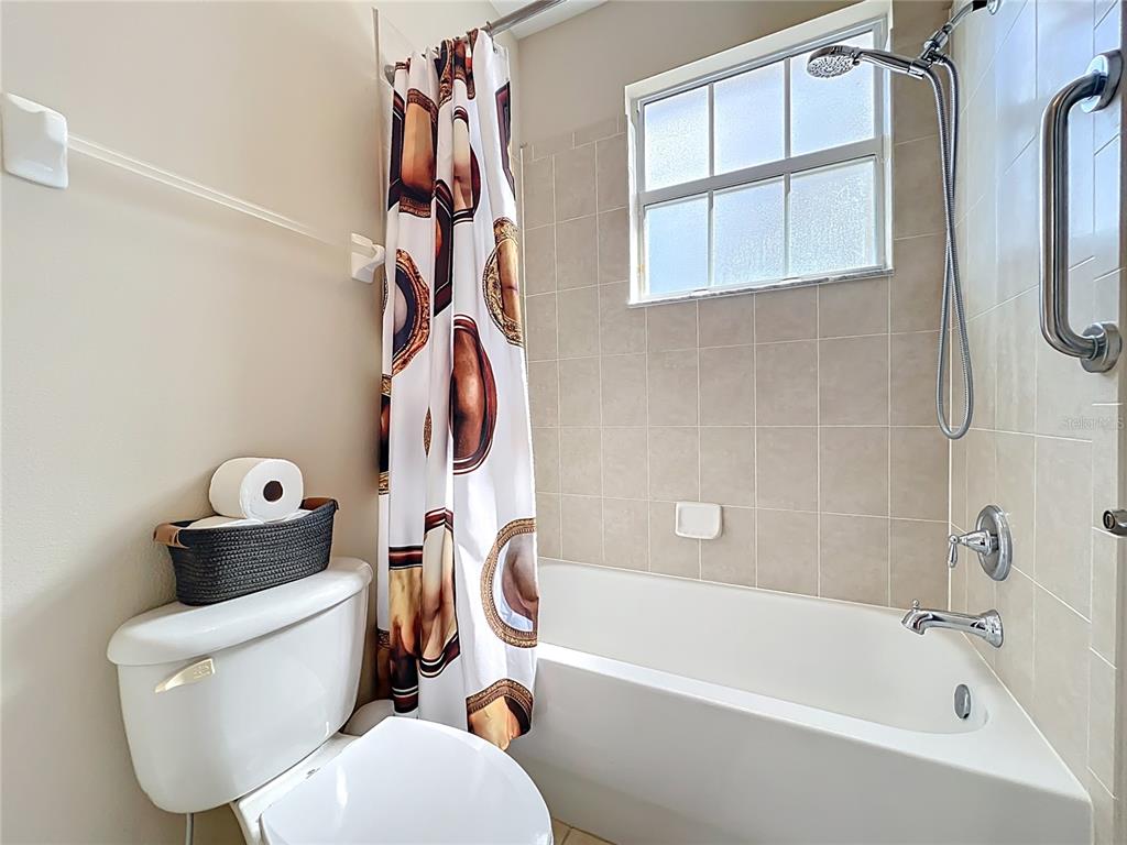 6573 Helmsley Circle Windermere, FL 34786 - Photo 46 of 54 a bathroom with a toilet and a bathtub