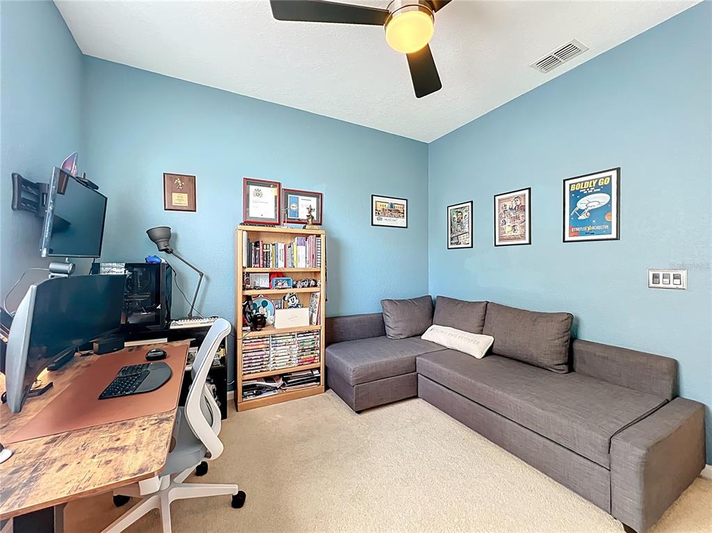 6573 Helmsley Circle Windermere, FL 34786 - Photo 47 of 54 a living room with furniture and a flat screen tv