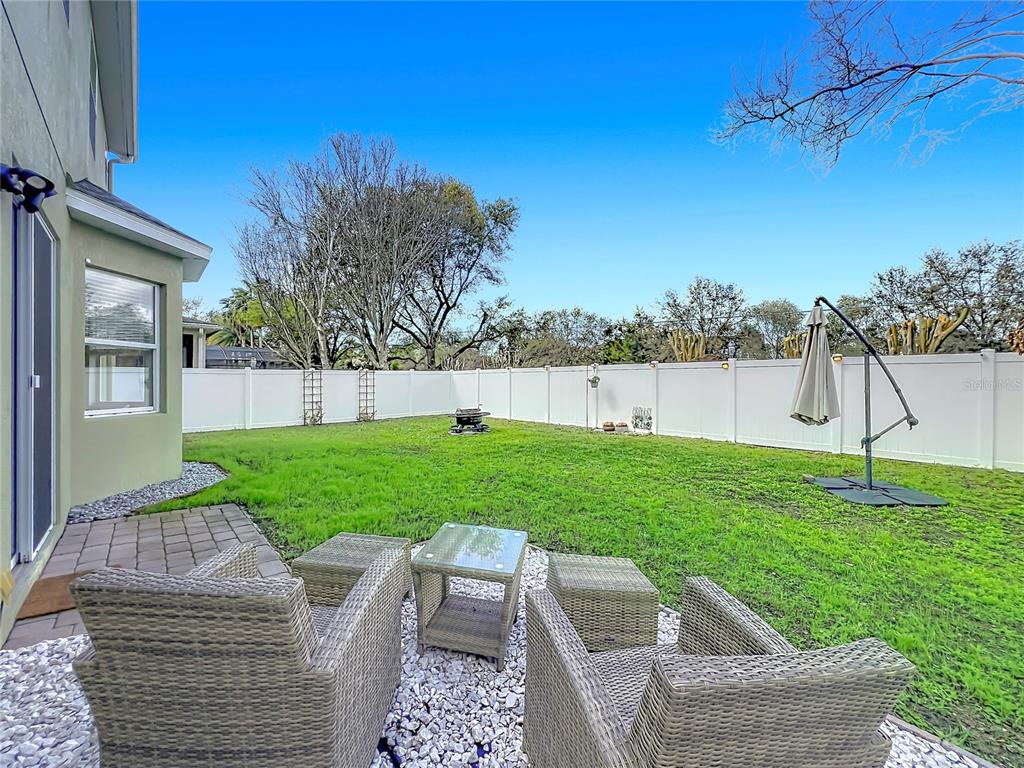 6573 Helmsley Circle Windermere, FL 34786 - Photo 49 of 54 a view of backyard with trampoline