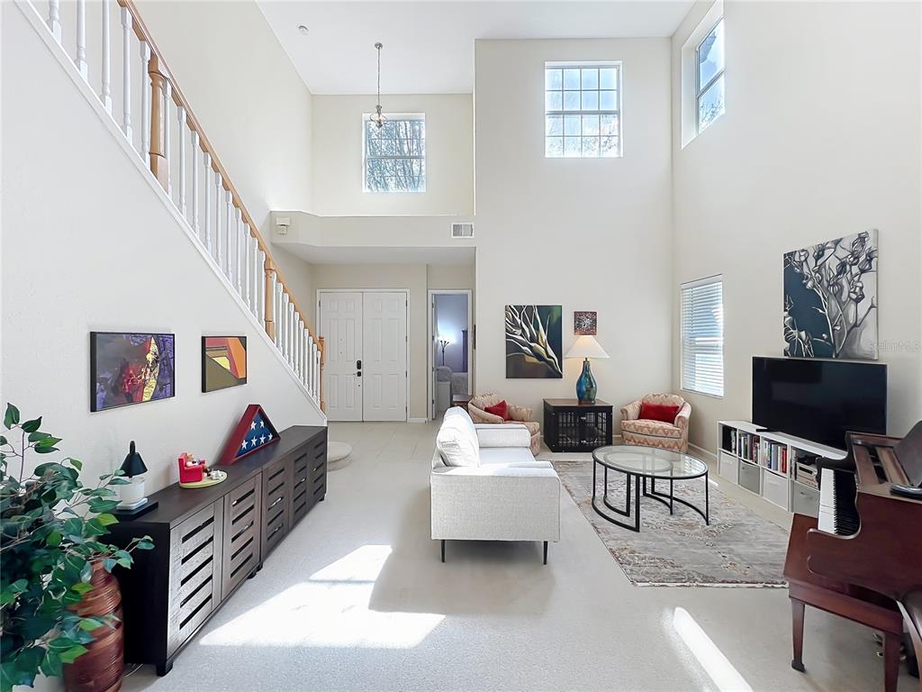 6573 Helmsley Circle Windermere, FL 34786 - Photo 8 of 54 a living room with furniture and a flat screen tv