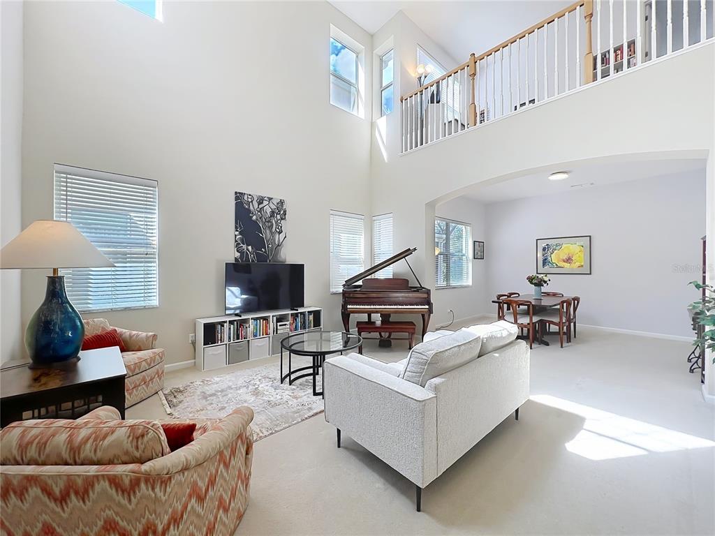 6573 Helmsley Circle Windermere, FL 34786 - Photo 10 of 54 a living room with furniture and a lamp