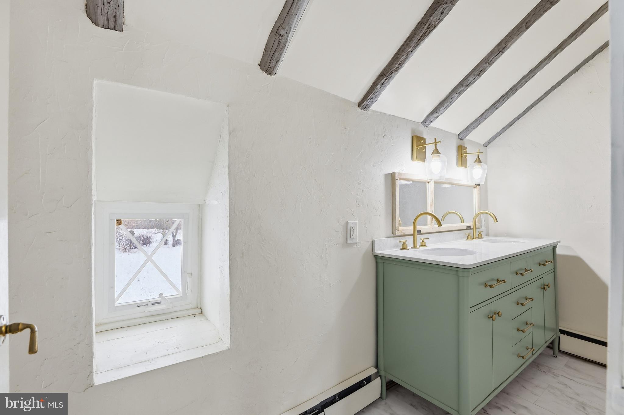 15539 Liberty Road Mount Airy, MD 21771 - Photo 24 of 68 a bathroom with a sink a mirror and painting on the wall