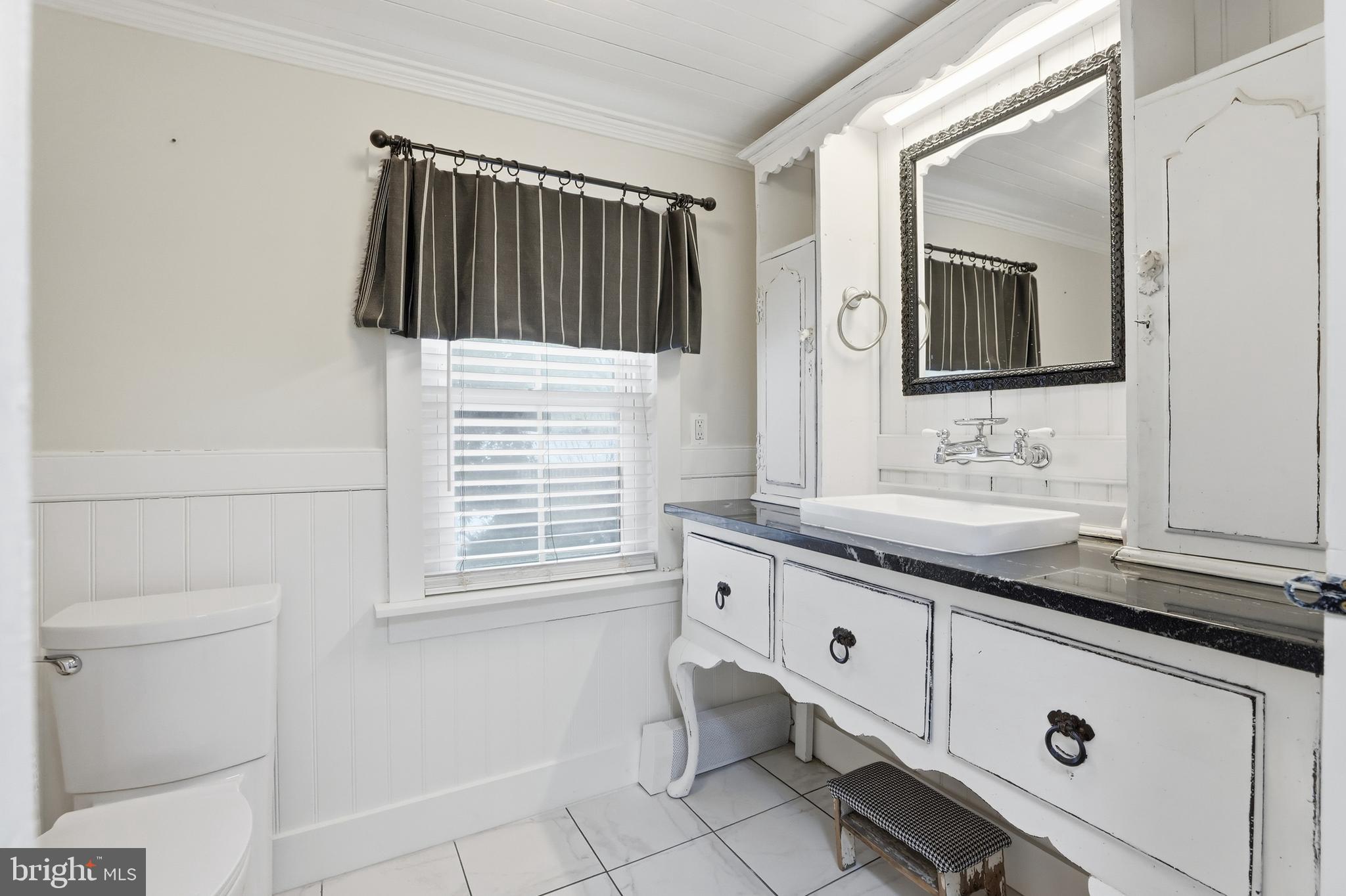 15539 Liberty Road Mount Airy, MD 21771 - Photo 29 of 68 a bathroom with a sink and a mirror