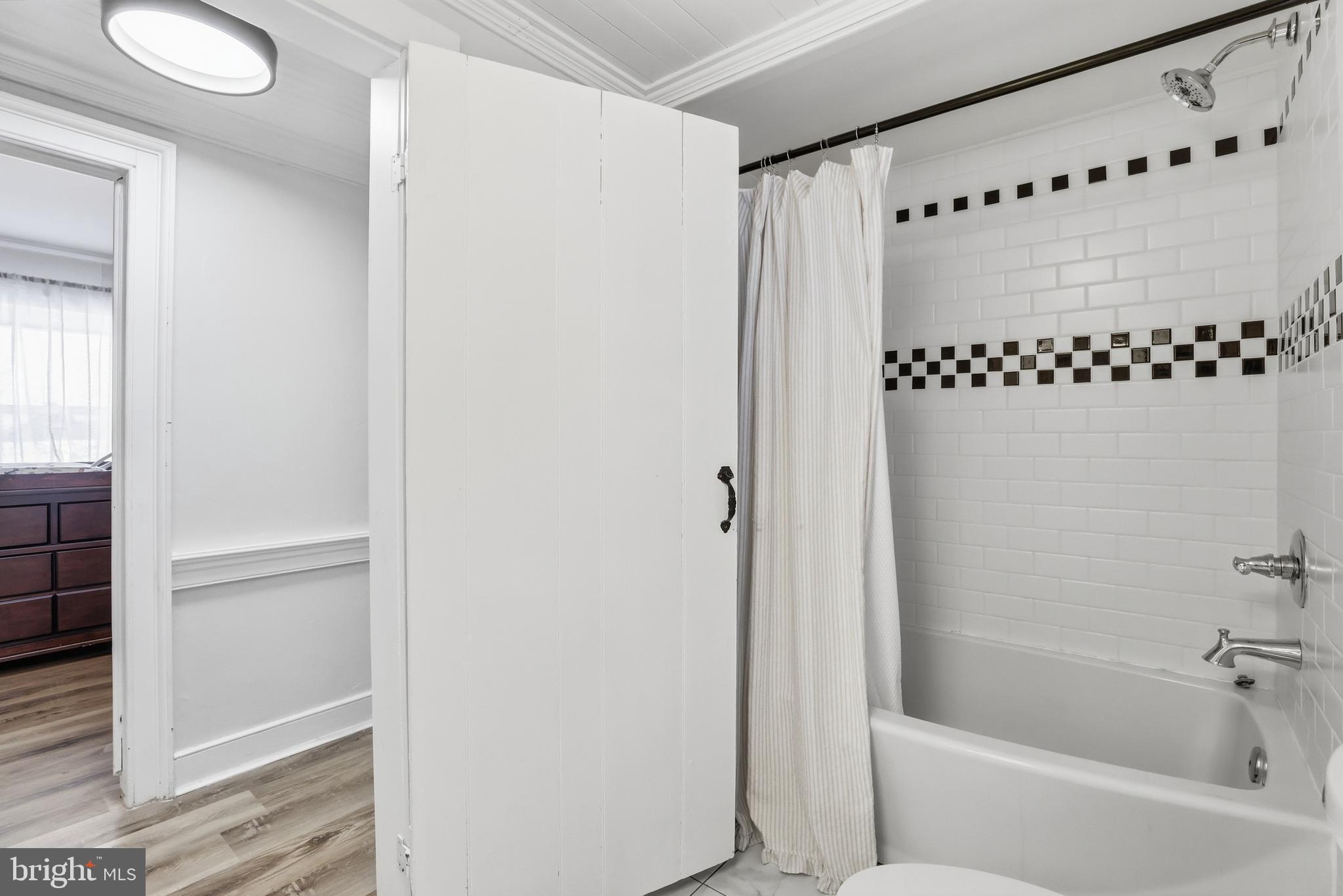 15539 Liberty Road Mount Airy, MD 21771 - Photo 30 of 68 a bathroom with a bathtub and shower