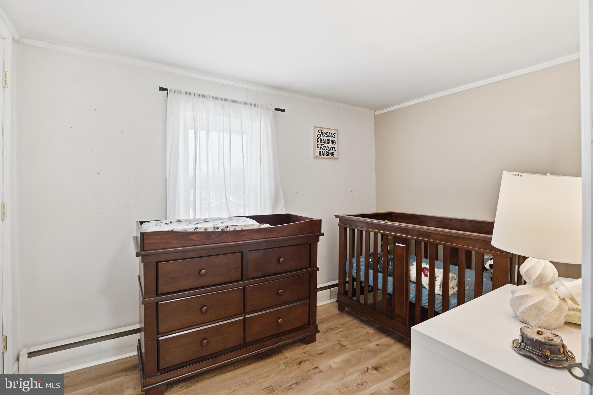 15539 Liberty Road Mount Airy, MD 21771 - Photo 31 of 68 a room with a baby crib and a dresser