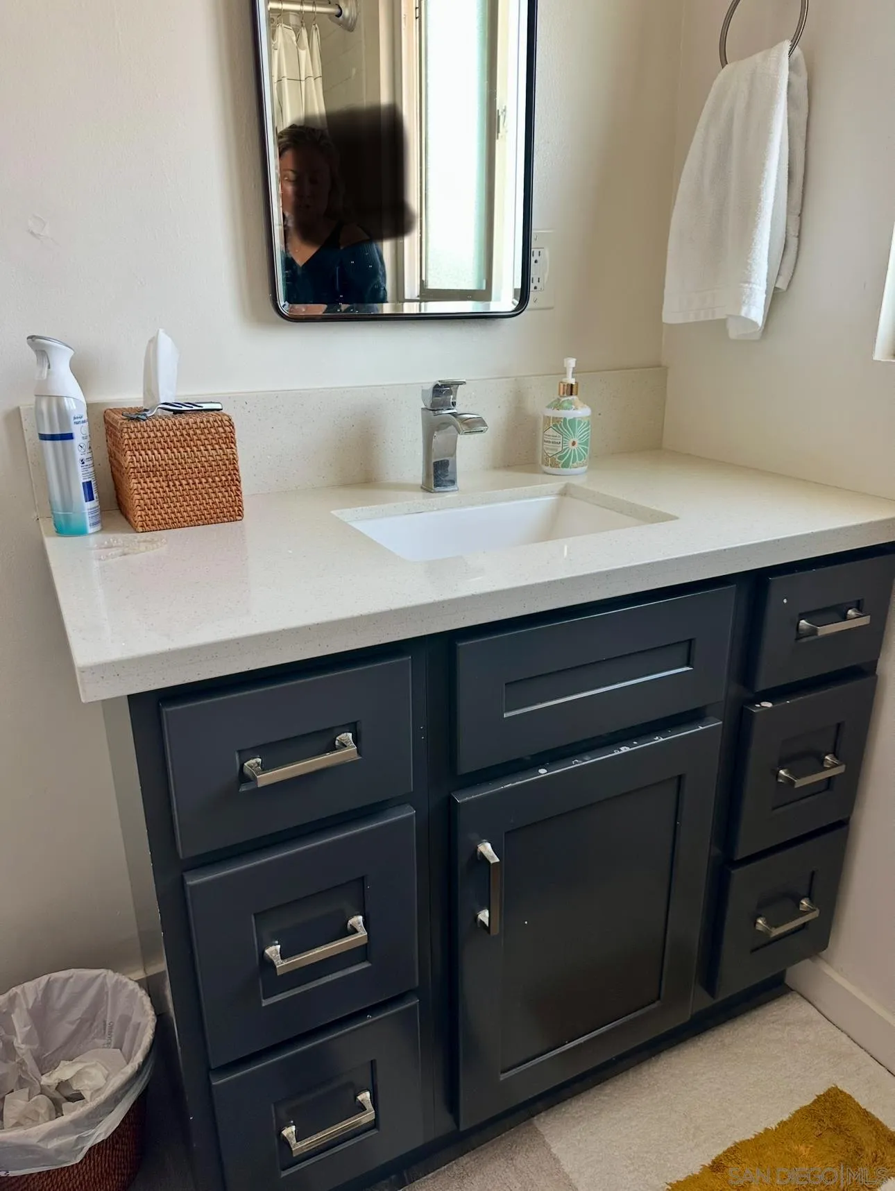 526 4th Street Encinitas, CA 92024 - Photo 6 of 10 a bathroom with a sink a light fixture and a toilet