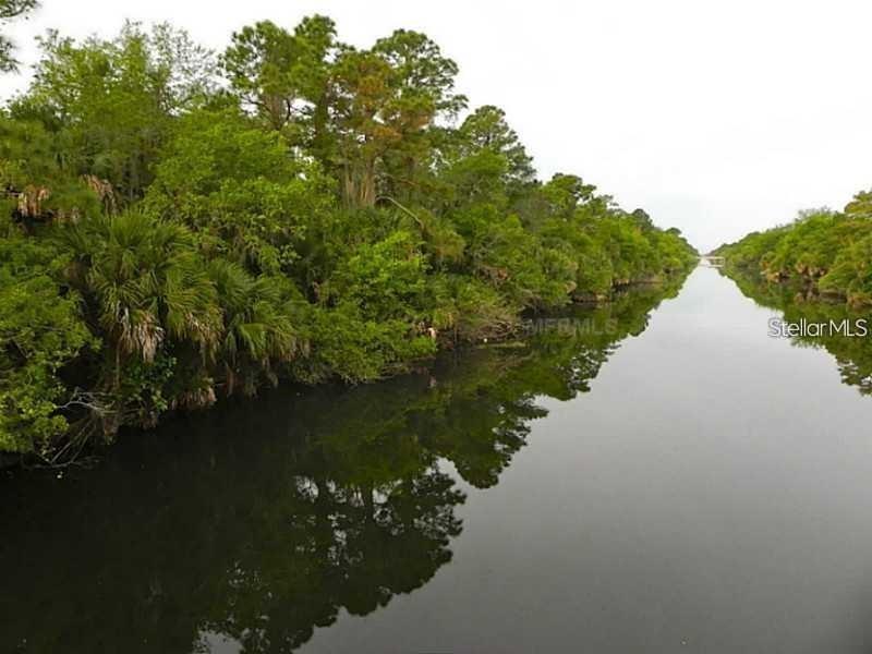 40 Inverness Street North Port, FL 34288 - Photo 2 of 6 a view of a lake from a yard