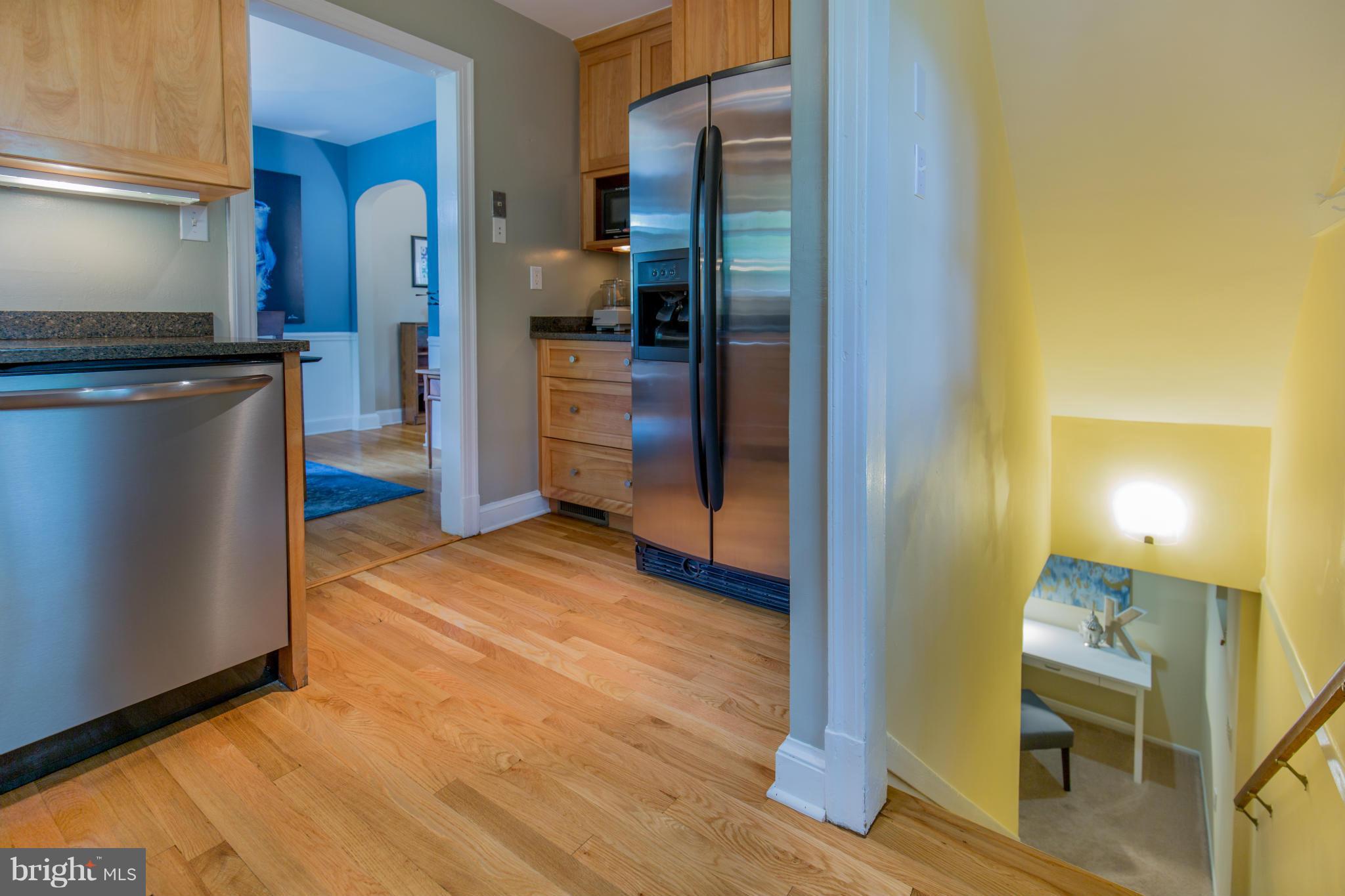 310 Brewster Court Silver Spring, MD 20901 - Photo 13 of 30 a view of a kitchen with wooden floor and a refrigerator