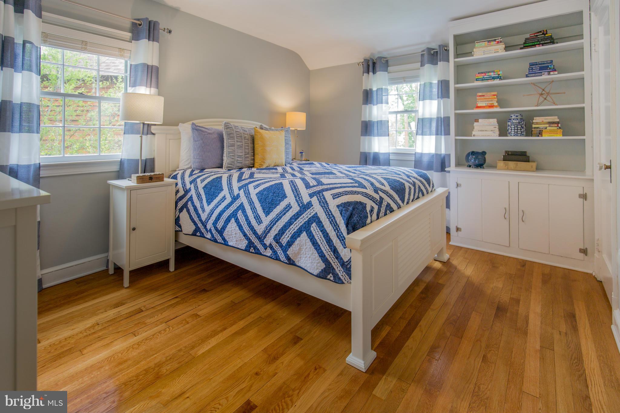 310 Brewster Court Silver Spring, MD 20901 - Photo 15 of 30 a spacious bedroom with a bed and a window