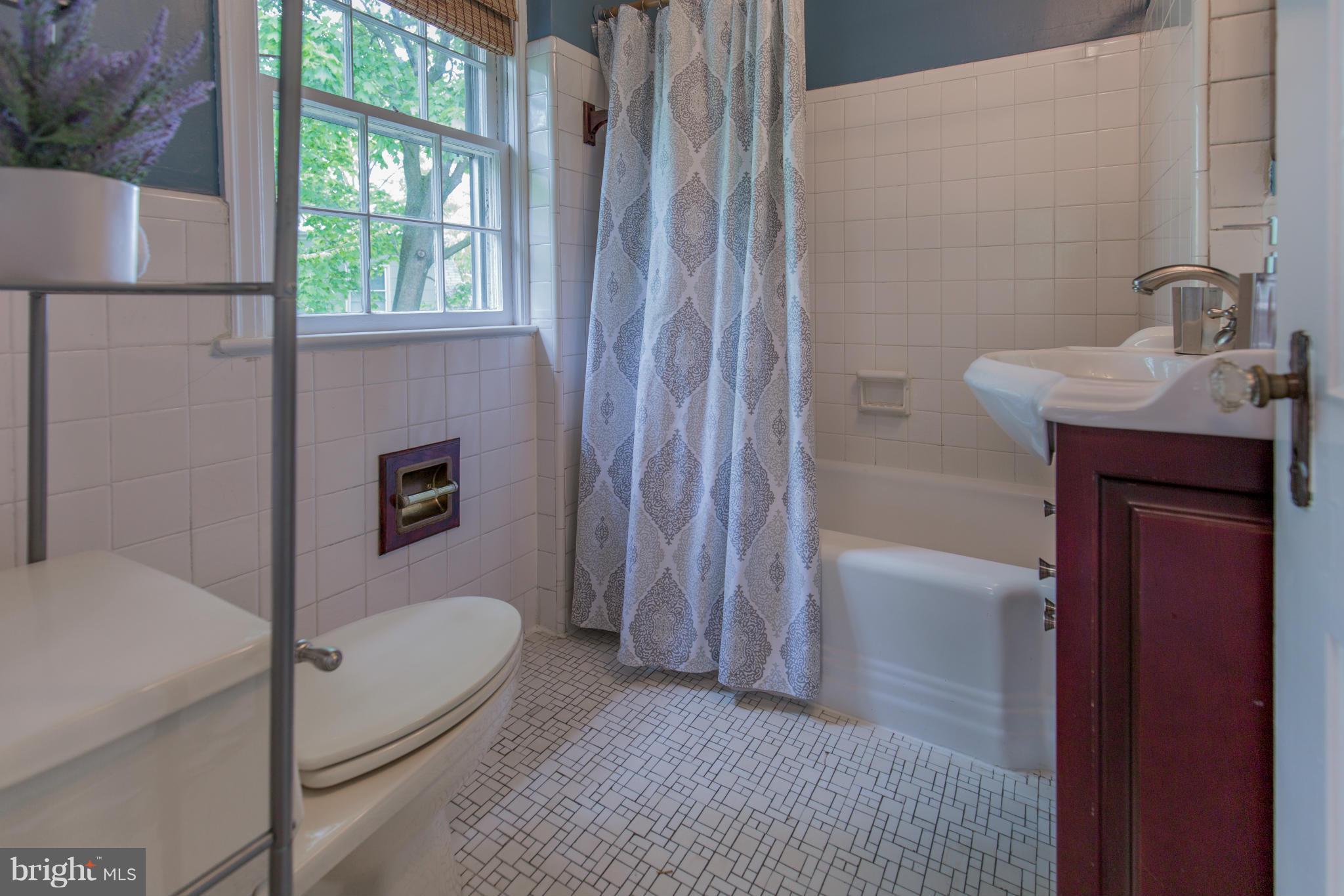 310 Brewster Court Silver Spring, MD 20901 - Photo 23 of 30 a bathroom with a sink a bathtub and a shower